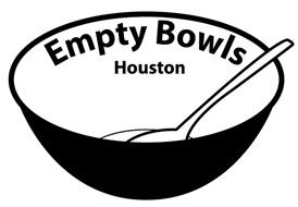 A black bowl with a white spoon resting inside. The words 