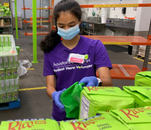 volunteer working at the Houston Food Bank