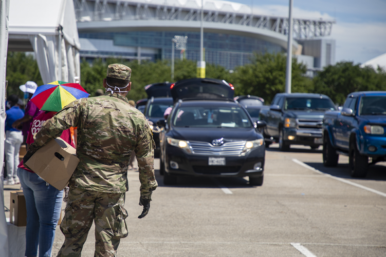 The National Guard helps Houston Food Bank distribute food at NRG in 2020.
