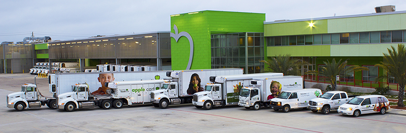 A fleet of vehicles ranging from cars to 18-wheelers all featuring the Houston Food Bank name.