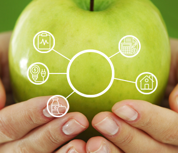 Hands holding green apple with icons representing the resources the Community Assistance Program assists with including health, food, housing, electricity, etc.