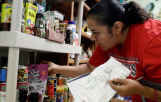 A woman shopping at a food pantry.