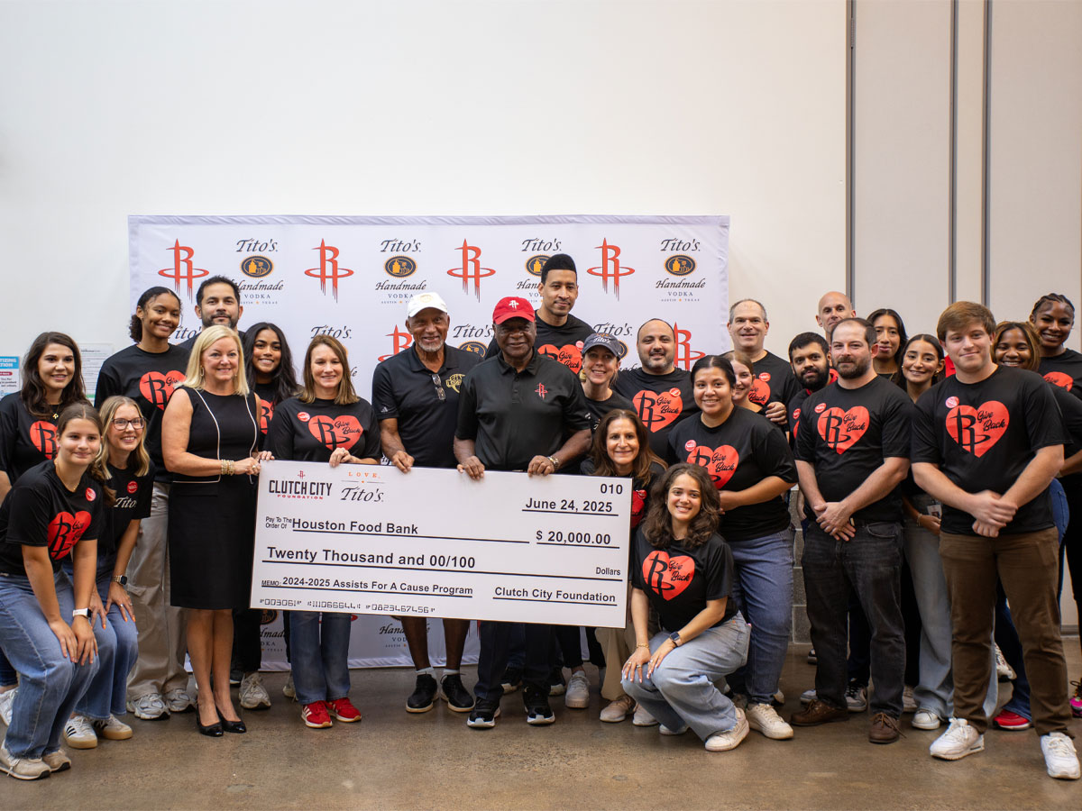 The Rockets and Tito's Vodka present a check to Houston Food Bank