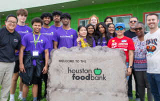 The unveiling of the Bedrock Boulder sign for Houston Food Bank.