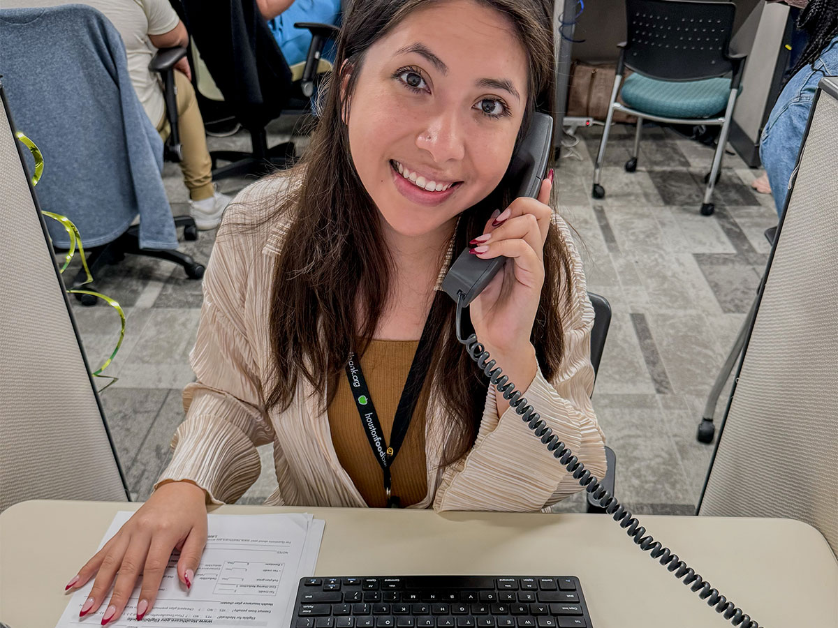 A Houston Food Bank professional answers the phone.